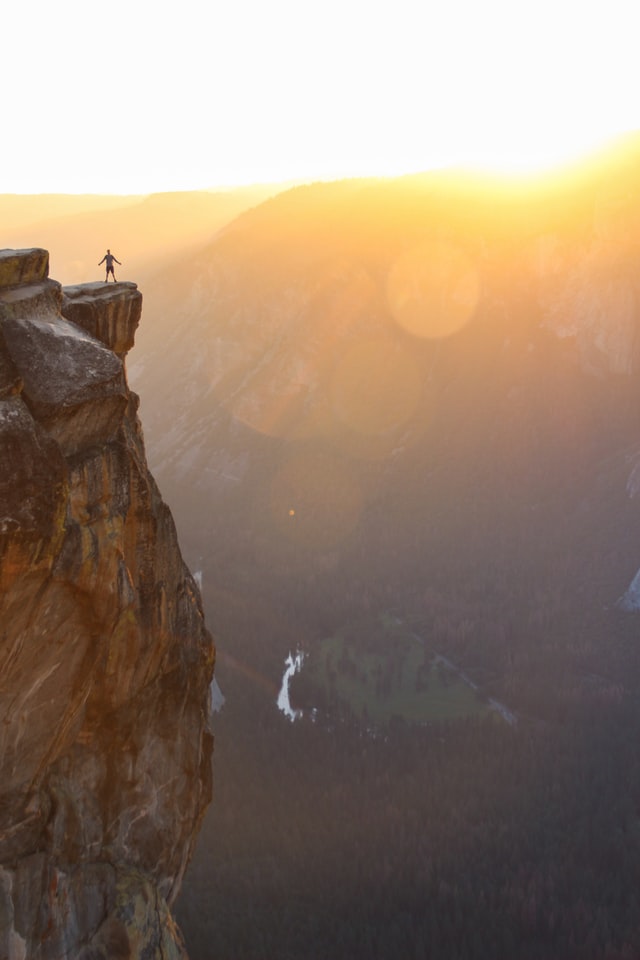 A climber atop a mountain